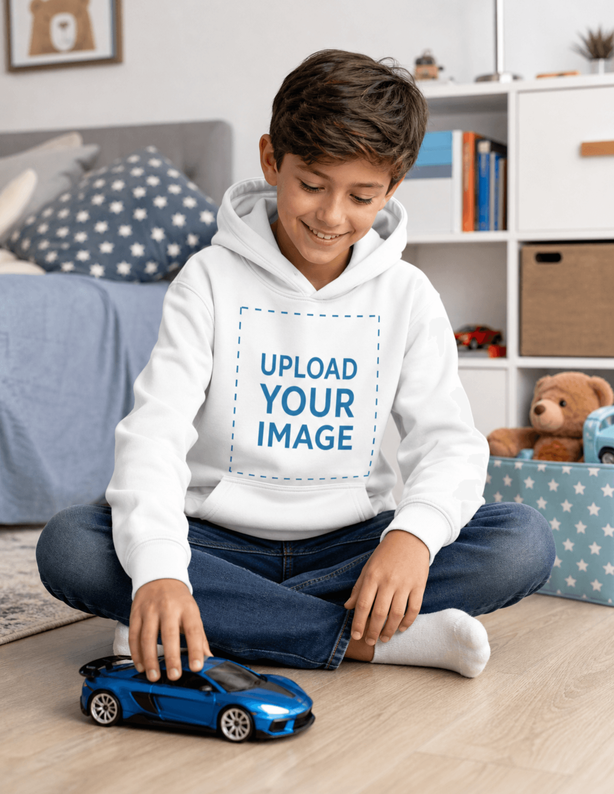 Free Boy Playing on the Floor in Hoodie Mockup Template to Edit Online