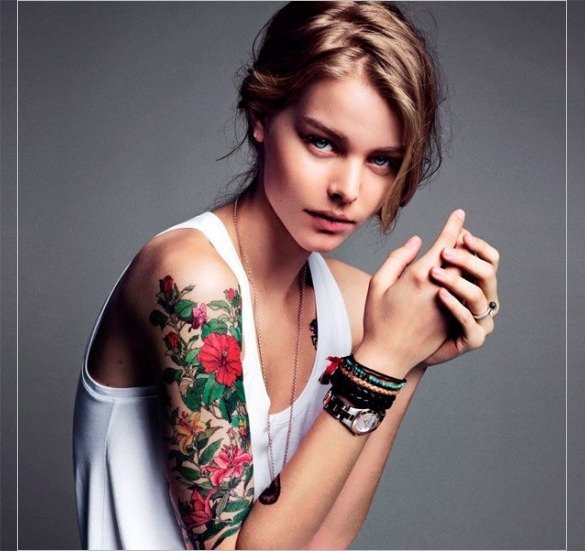 girl with flower tattoo on sleeve