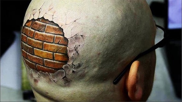 hitting-your-head-against-a-brick-wall-tattoo