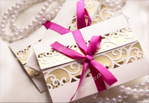 handmade wedding invitations with fuchsia ribbon