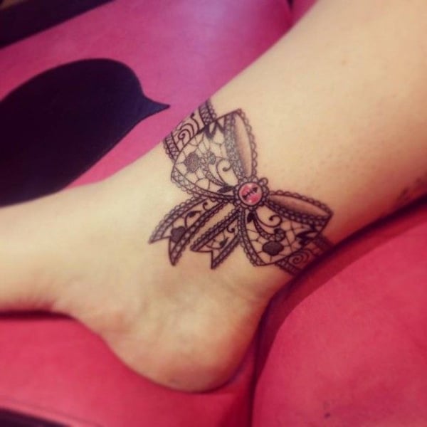 beautiful ribbon tattoo design around the ankle