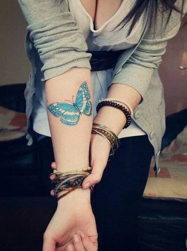 arm butterfly tattoo on girl