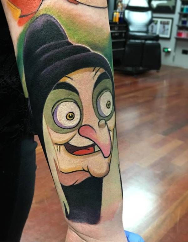 snow white evil witch arm tattoo
