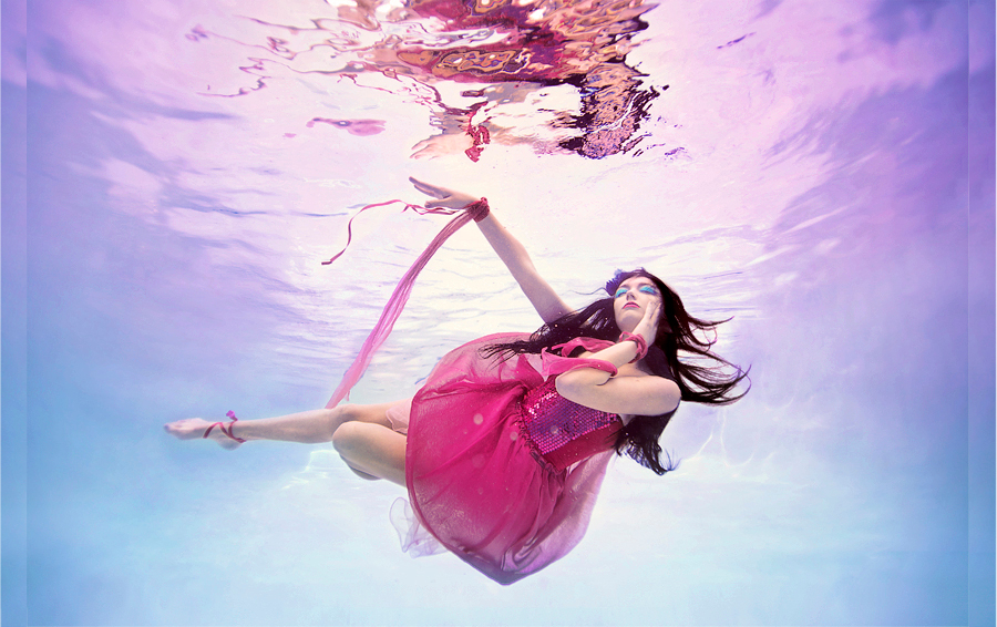 girl dancing under water