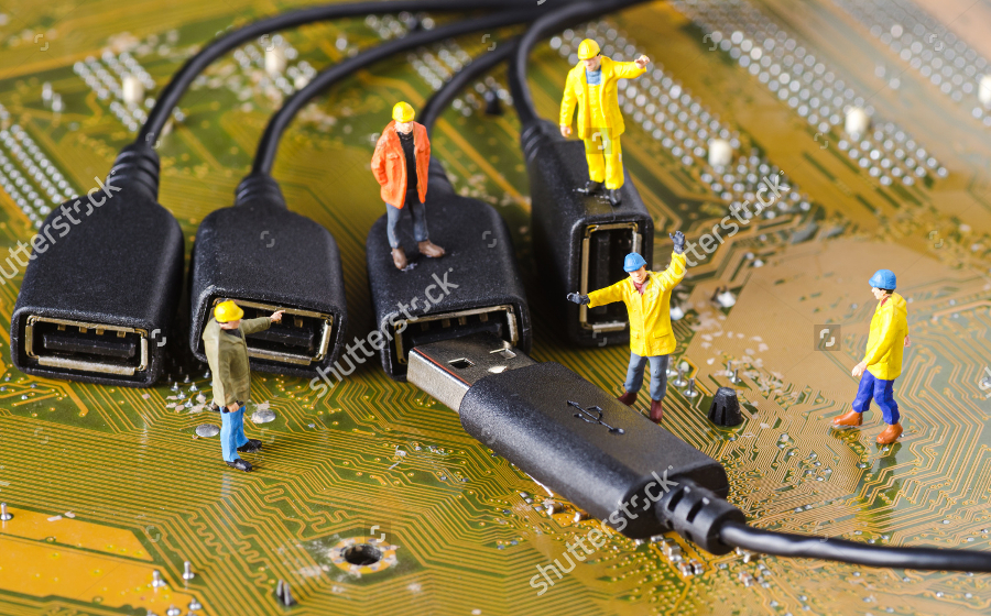 miniature technicians connecting cables