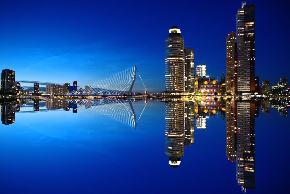 mirrore image of high rise buildings bridge