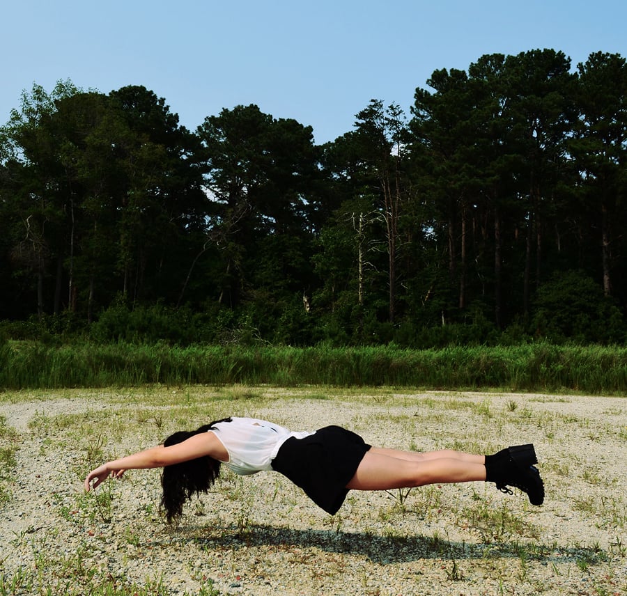 woman floating on earth
