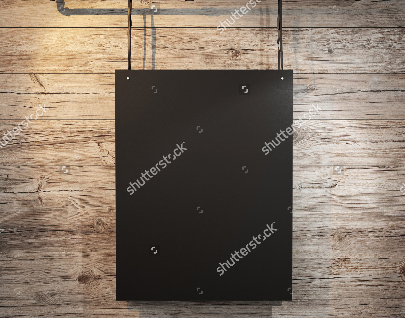 black poster hanging on wood background