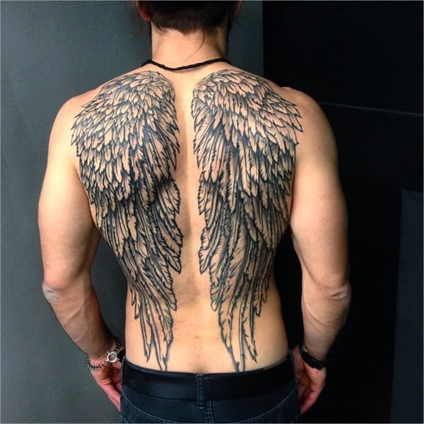 torn feathers angel wings tattoo