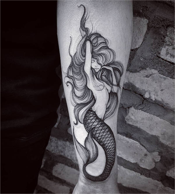 black mermaid forearm tattoo