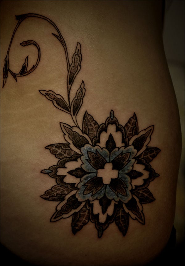 traditional geometric flower tattoo