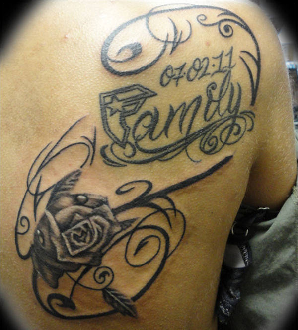 family first tattoo on chest with roses