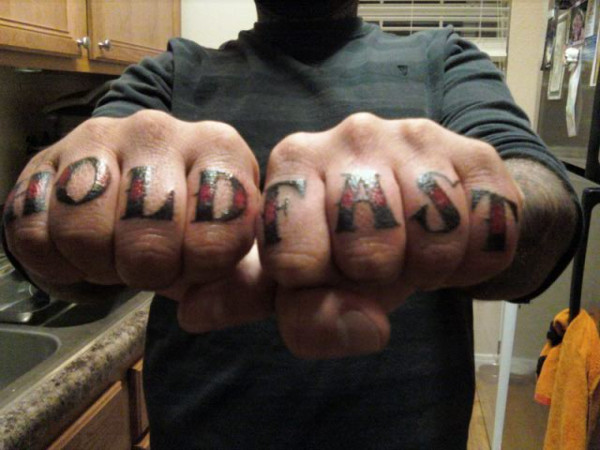 typography finger tattoo
